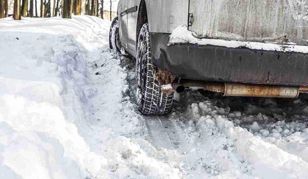The driver got stuck in the snow while waiting for the winch-out team